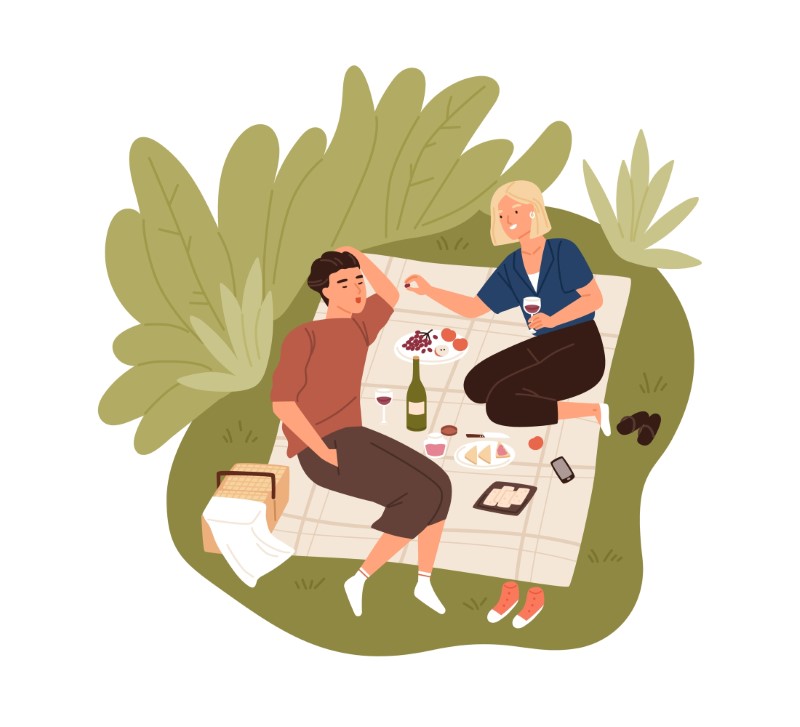 Vektorgrafik von zwei Menschen, die ein Picknick als ihr erstes Date haben